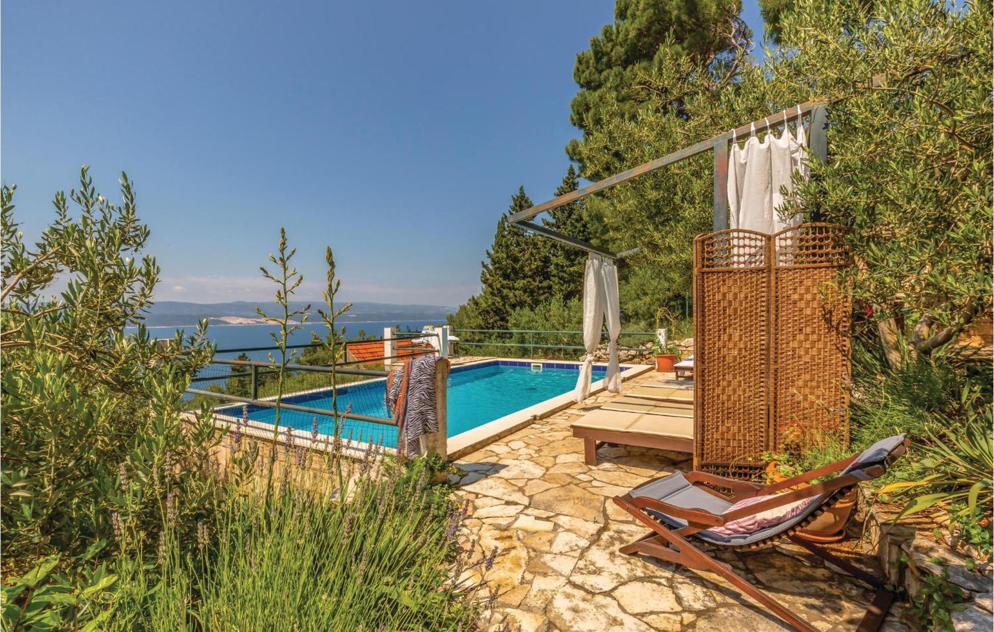 Holiday home Cozy In With Outdoor Swimming Pool Mimice
